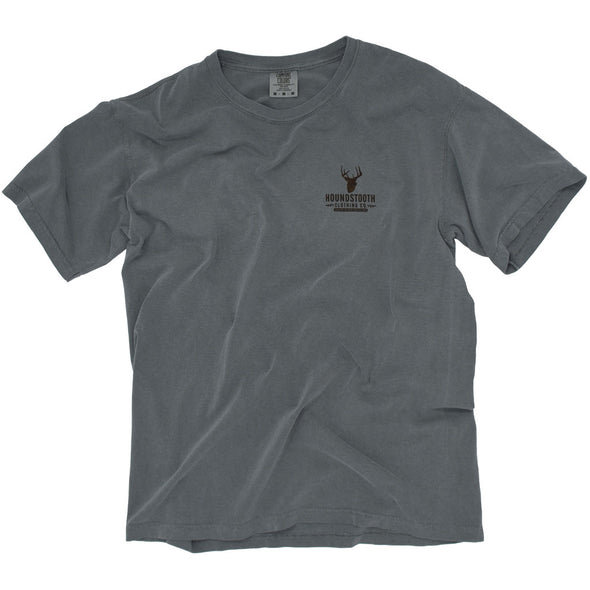 A grey t shirt with a woodcut image of a Buck standing in an Arkansas field.