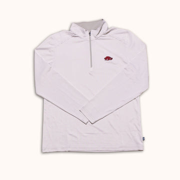 A light pink and white striped long-sleeve quarter-zip pullover with a small red Arkansas Razorbacks logo on the left chest, displayed flat against a cream background.