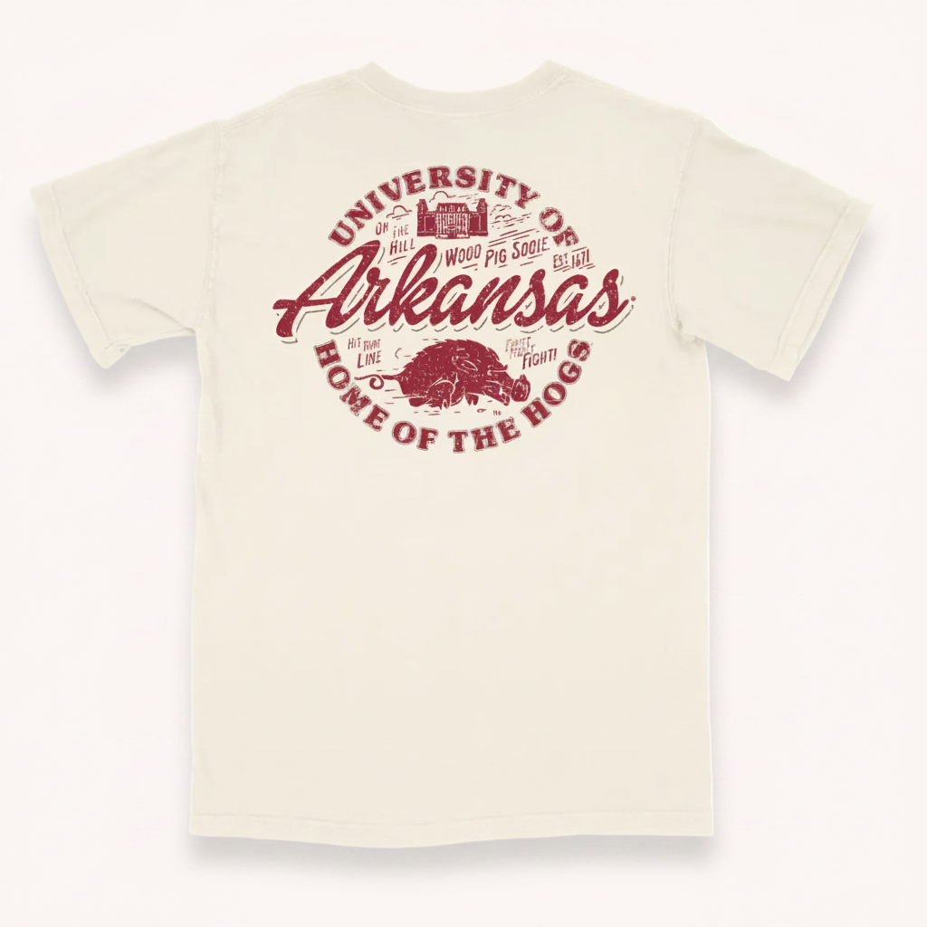 Houndstooth Clothing Company t-shirt featuring the Arkansas Razorbacks logo. The design displays the text 'University of Arkansas' and 'Home of the Hogs' in a distressed red font