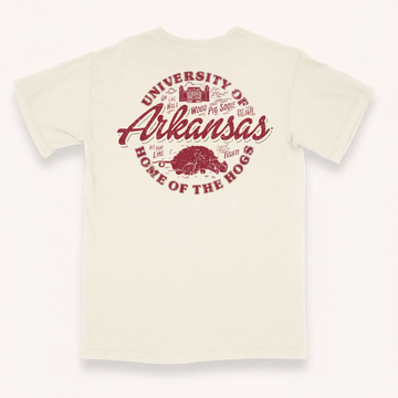 Houndstooth Clothing Company t-shirt featuring the Arkansas Razorbacks logo. The design displays the text 'University of Arkansas' and 'Home of the Hogs' in a distressed red font