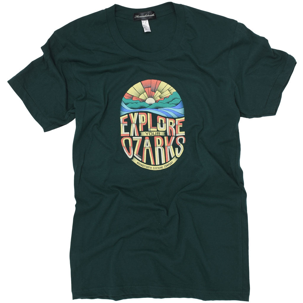 A soft green shirt with an Ozark Sunrise above the test explore your Ozarks.